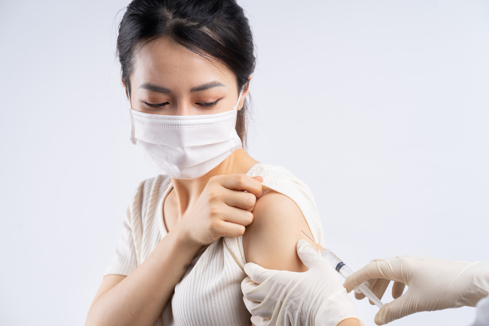 asian-woman-get-vaccinated-against-covid-19-white
